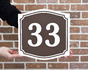 Знак с номером дома в коричневой гамме